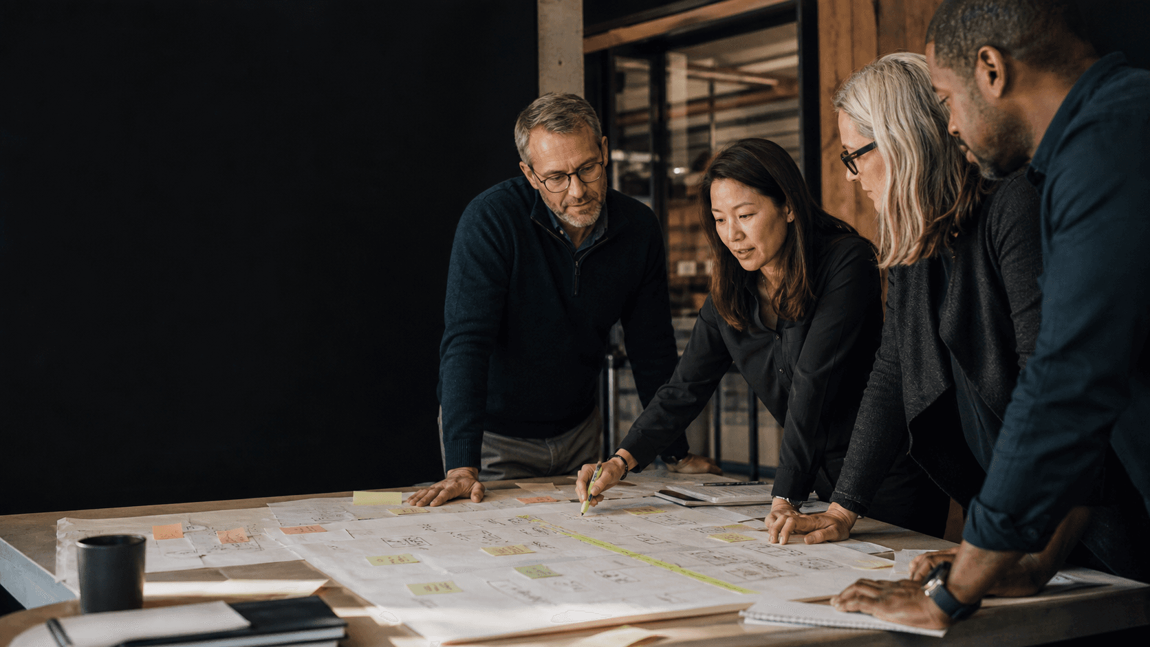 A cross-functional team examining work, roles, and decisions together